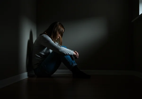 Person feeling overwhelmed by fear of abandonment, alone