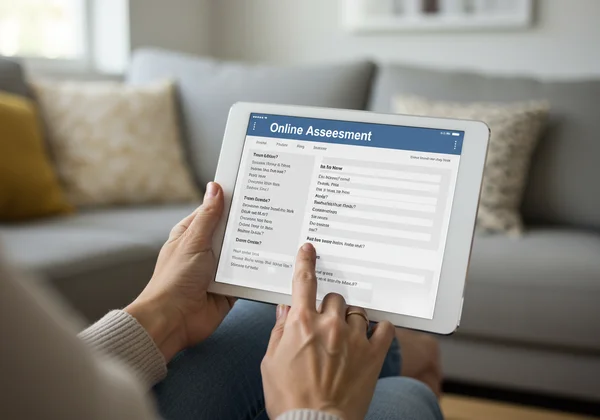Person taking a BPD assessment on a tablet, calm setting.